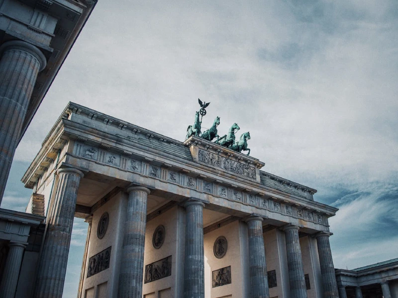Brandenburg Gate beautifully lit up against the night sky in Berlin