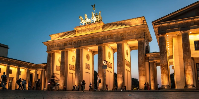 Brandenburg Gate illuminated at night in Berlin