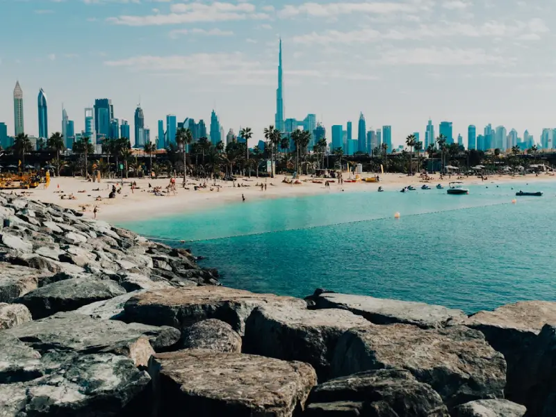 Burj Khalifa glowing in golden sunrise light overlooking Dubai's cityscape