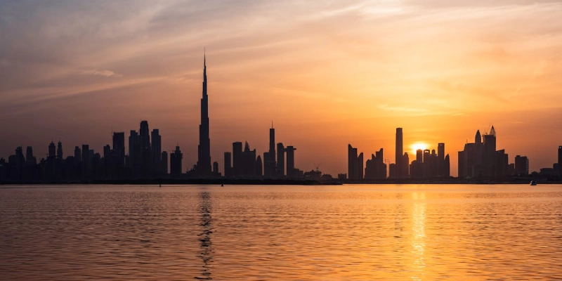 Burj Khalifa at sunset glowing with warm golden tones