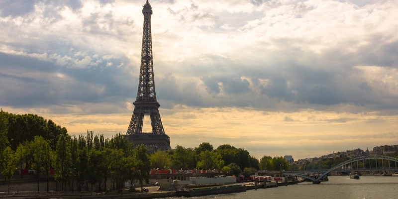 Eiffel Tower illuminated at night with golden lights