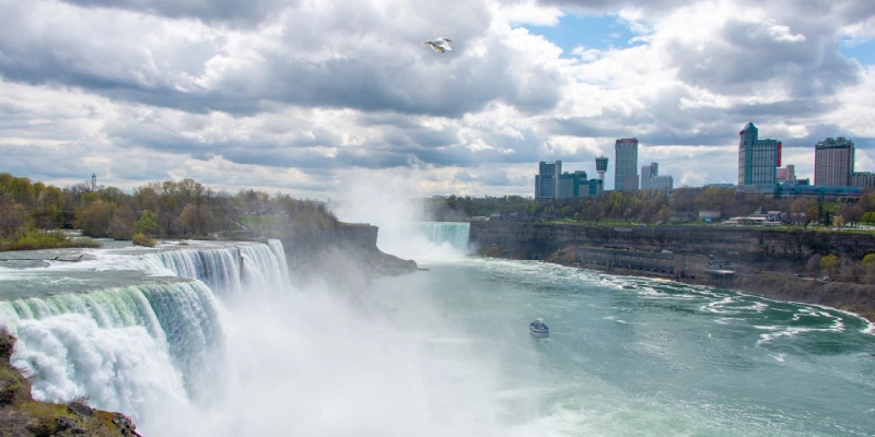 Tourists enjoying the scenic view of Niagara Falls from the American Observation Deck