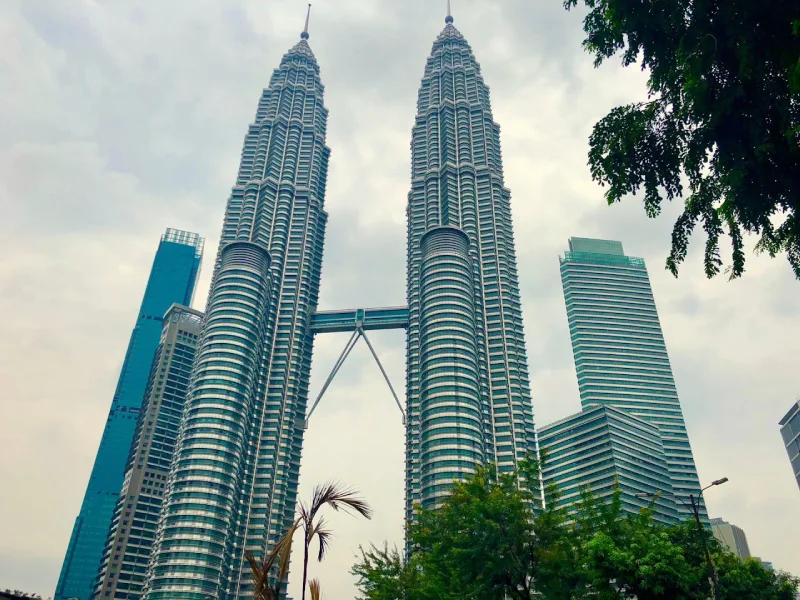 Sunset view of the Petronas Twin Towers towering above Kuala Lumpur skyline